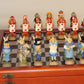Alice in Wonderland Chessmen on Cherry Stained Chest Chess Set